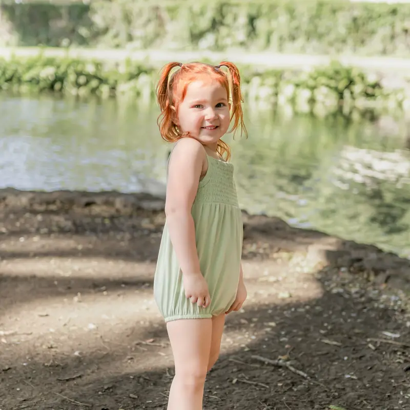 Smocked Bubble Romper In Basil 1